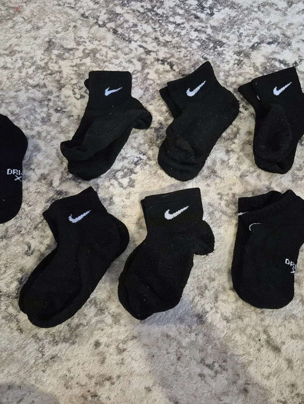 8 pairs of Nike black xs socks and 3 extra no matches socks
